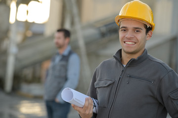 portrait of a happy petrochemical worker outside the factory