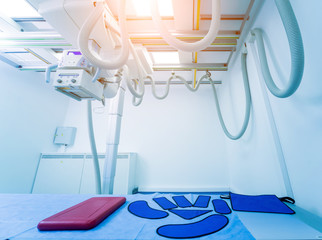 X-ray room in a hospital. Classic ceiling-mounted x-ray system.
