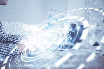 A man working on computer with technology theme drawing. Concept of big data. Multi exposure.