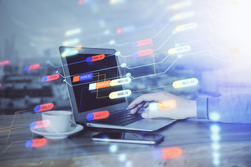 Multi exposure of technology hologram with man working on computer background. Concept of big data.