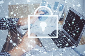 Multi exposure of lock icon with man working on computer on background. Concept of network protection.
