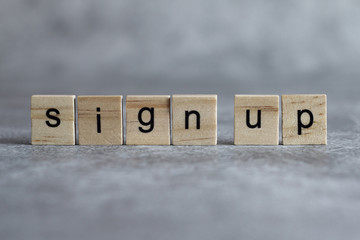 Sign up word written on wood cube