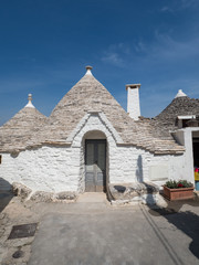 Italy, april 2019: Alberobello is a small town and comune of the Metropolitan City of Bari. The trulli of Alberobello have been designated as a UNESCO World Heritage farmyard