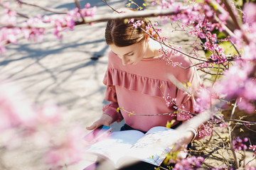 girl near a flowering tree