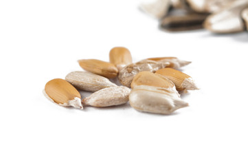 Peeled sunflower seeds isolated on white background.Copy space