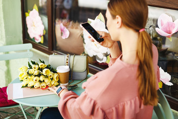 girl makes a photo on the phone