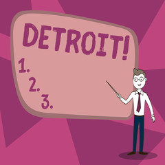 Word writing text Detroit. Business concept for City in the United States of America Capital of Michigan Motown Confident Man in Tie, Eyeglasses and Stick Pointing to Blank Colorful Board.