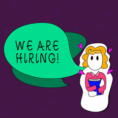 Text sign showing We Are Hiring. Conceptual photo recently employ someone or pay him to do particular job Girl Holding Book with Small Hearts Around her and Two Color Speech Bubble.