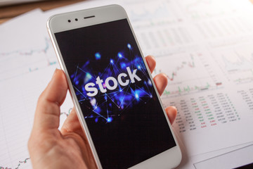 Investment in stocks, concept. Reports and statistics, analysis of the securities market.