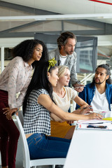 Business people working together on computer at conference room in a modern office