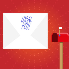 Writing note showing Local Seo. Business photo showcasing incredibly effective way to market your near business online White Envelope and Red Mailbox with Small Flag Up Signalling.