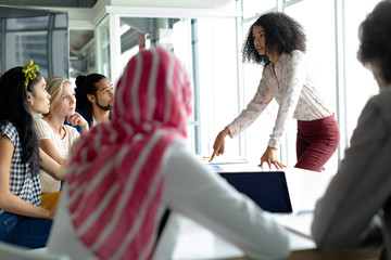 Fototapeta premium Business people discussing with each other at conference room in a modern office