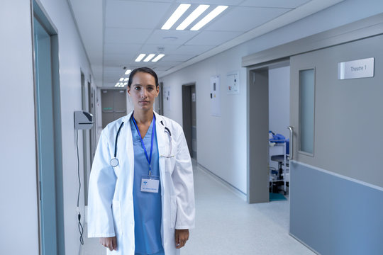 Female doctor standing in the corridor at hospital
