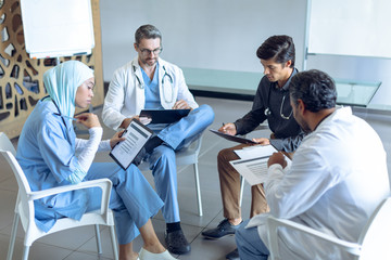 Medical team reading documents together in the hospital