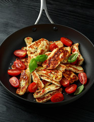 Pan-seared halloumi cheese and sweet cherry tomatoes salad