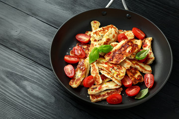 Pan-seared halloumi cheese and sweet cherry tomatoes salad