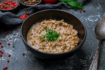 porridge boiled from spelt on bowl