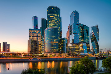 Plakat Moscow cityscape with skyscrapers of Moscow-City at sunset, Russia. Moscow-City is a business district on embankment of Moskva River. Panorama of modern tall buildings in the Moscow center at night.