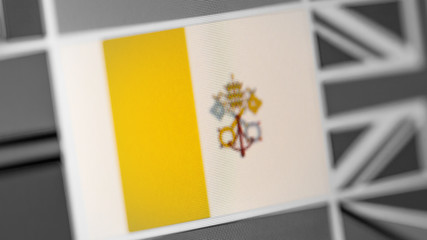 Vatican national flag of country. Vatican flag on the display, a digital moire effect.