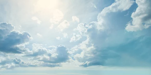 Fototapeten Blue sky clouds background. Beautiful landscape with clouds and sun © millaf
