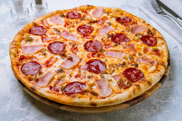 Italian meat pizza on board