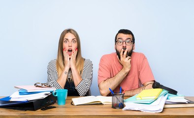 Students with many books with surprise and shocked facial expression