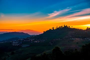 A Tranquil Scenic Landscape of Beautiful Sunset with the Resort Camping at Mon Jam, Chiang Mai, Thailand.
