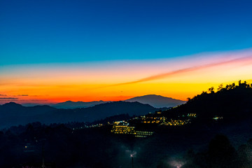 A Tranquil Scenic Landscape of Beautiful Sunset with the Resort Camping at Mon Jam, Chiang Mai, Thailand.