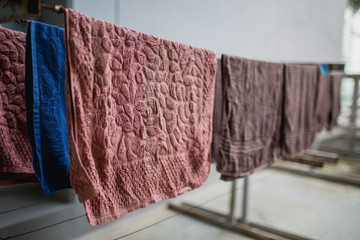 towels hanging on wooden wall