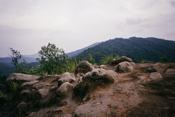 mountains with rocks on the foreground