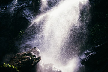 The water spray from the waterfall closeup