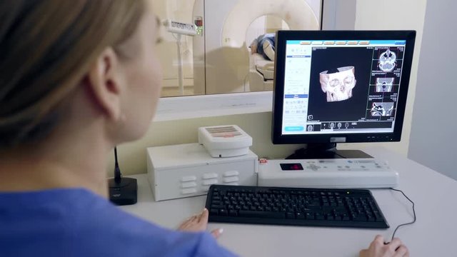 A hospital patient is scanned by thomograph