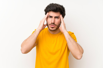 Handsome over isolated white wall unhappy and frustrated with something. Negative facial expression