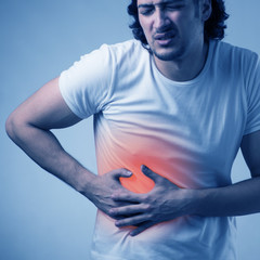 Man suffering from acute pain on abdomen