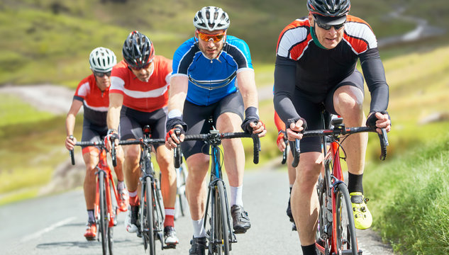 Cyclists out racing along country lanes in the mountains in the United Kingdom.