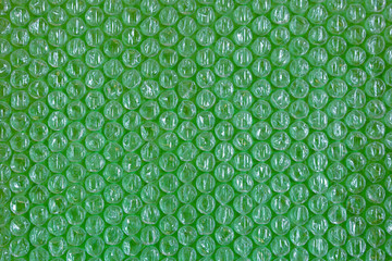 plastic background texture cellophane wrapping packing wrap packet bead ball green greens ufo...