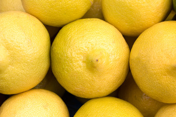 lemons at grocery store or market, closeup