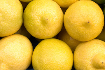 lemons at grocery store or market, closeup