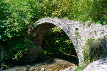 Fototapeta na wymiar Tripotama bridge (Ibrahim bridge) and Eurimanthos river in Tripota village, Achaia, Peloponnese, Greece