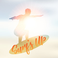Silhouette of a surfer on a defocussed summer background