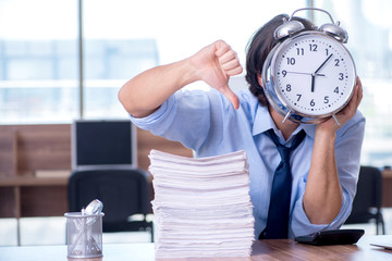 Young employee unhappy with excessive work 