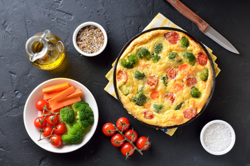 Omelette with broccoli and tomatoes