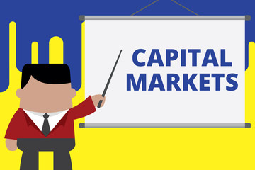 Handwriting text writing Capital Markets. Conceptual photo Allow businesses to raise funds by providing market security Businessman standing in front projector screen pointing project idea