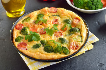 Omelet with broccoli and tomatoes