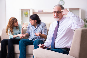 Young pair visiting experienced doctor psychologist