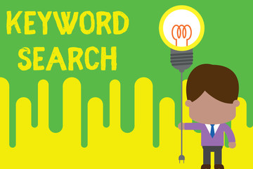 Handwriting text Keyword Search. Conceptual photo Using word or term to look correct subject associated to it Standing man tie holding plug socket light bulb to connect idea. Startup