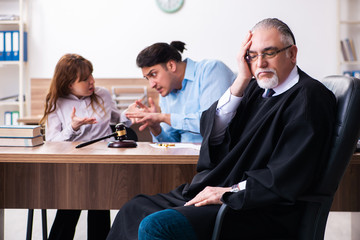 Young couple in the courthouse in divorce concept  