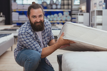 Healthy sleep concept. Handsome bearded mature man smiling to the camera, shopping for new...