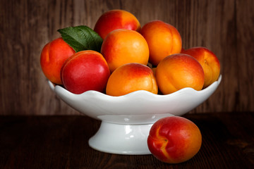 Apricots in a white porcelain vase