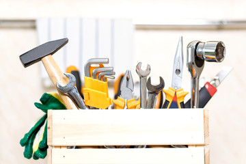 construction tools in wooden box in kitchen